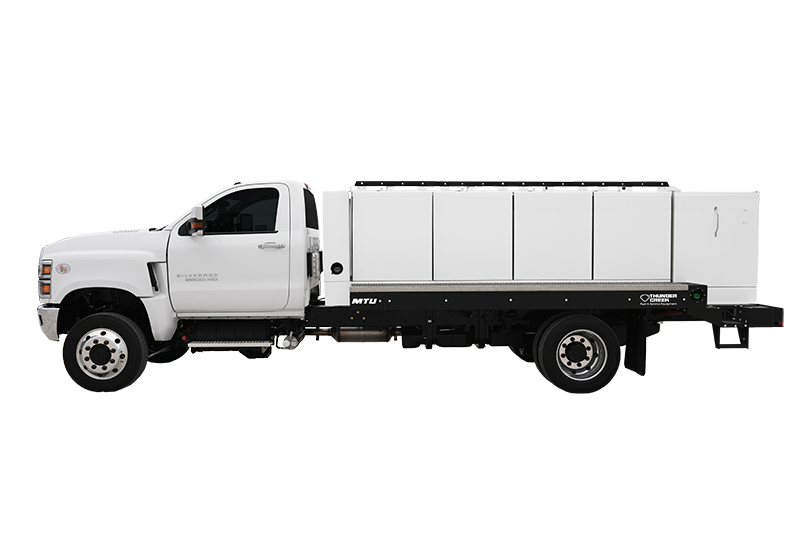 Thunder Creek's White Multi fuel tank Truck Upfit (No-HAZMAT Fuel and Service Trailer) fits 920 gallons of liquid and the fuel tank is placed on top of a white chassis truck parked in its driver's side view.